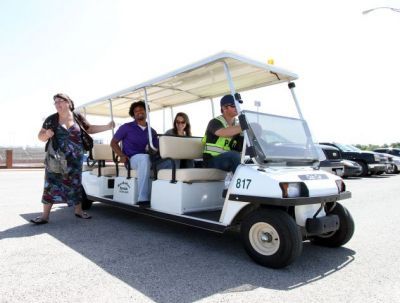 Last year the Texan Shuttle Service was implemented in an effort to alleviate parking problems. Here, students are dropped off by a shuttle driver.