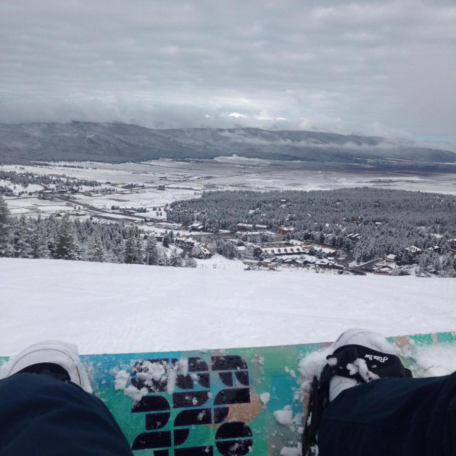 Snow boarder Klaire Brock, snaps a quick photo of Angel Fire village before heading down the slope. 