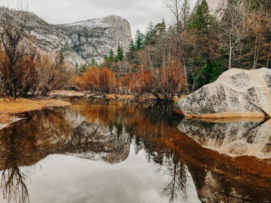 Emily Miller stops to take a picture of the South Dome and the reflection of South Dome in Mirror Lake at Yosemite National Park on her hike in January. 