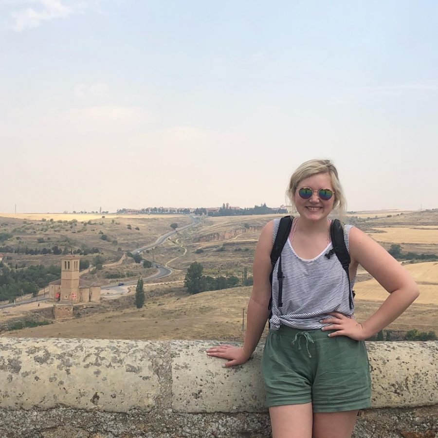 Caitlyn Oxford stands on a castle, Alcazar de Segovia, in Segovia, Spain while on a weekend trip during her time on the Burgos, Spain study abroad. 