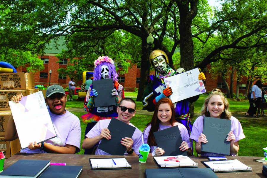 Omar Herera, Joseph Seaman, Hannah Ekwall, and Shelby Smith promote the Grassburr with the Purple Poo. The Grassburr is the official yearbook of Tarleton, started in  1916. 