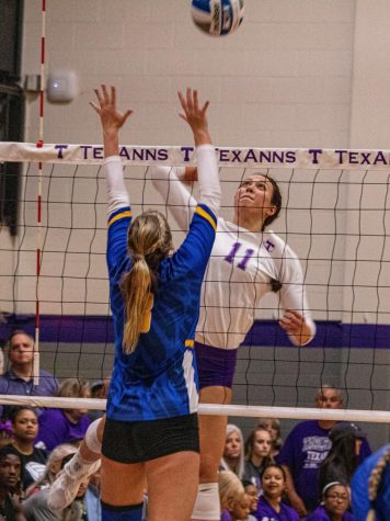 Lauren Kersey jumping to spike the volleyball against St. Marys during Parent Weekends match up on September 21, 2019.