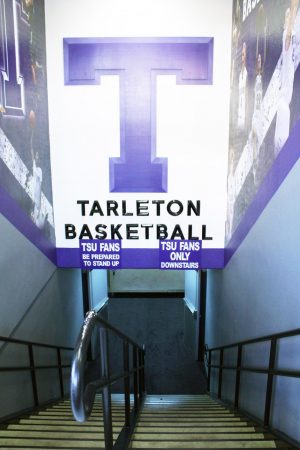 The Tarleton Basketball sign hangs over the stairway to enter the basketball court in Wisdom Gym.