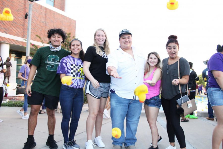 Yoseline Hernandez, Jessica Vaden, Justin Montalbo, Hailey Campbell
and Zugelly Idaly Espinosa launching their ducks into the Nursing
Building reflecting pool on Oct. 13, 2020 during TSU Spirit week.