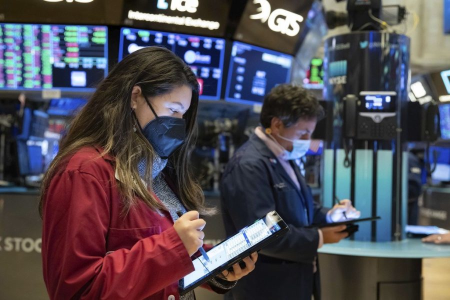 In this photo provided by the New York Stock Exchange, trader Ashley Lara works on the floor, Friday, Jan. 29, 2021. GameStops stock is back to the races Friday, and the overall U.S. market is down again, as the saga thats captivated and confused Wall Street ramps up the drama.