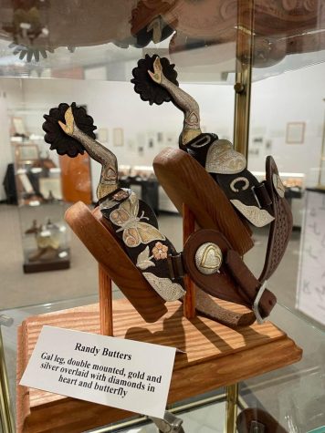 This pair of spurs was built by Randy Butters, Edmondson had them built for his late granddaughter. The spurs include motifs such as gal legs, hearts, flowers and butterflies.