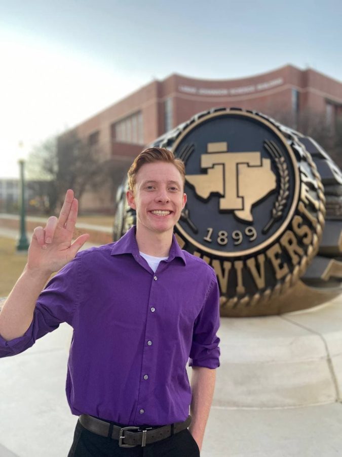 Thedford shows his Tarleton Pride in front of the Ring Statue