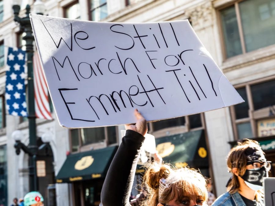 A woman holds a sign in honor of Emmett Till during a protest on June 13, 2020, in Chicago. Protests erupted across the U.S. after George Floyd was killed while in police custody in Minneapolis on May 25, 2020.
Natasha Moustache/Getty Images
