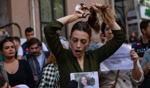 Nasibe Samsaei, an Iranian woman cuts her ponytail off during a protest following the death of an Iranian woman after her arrest by the country’s morality police in Tehran. 


